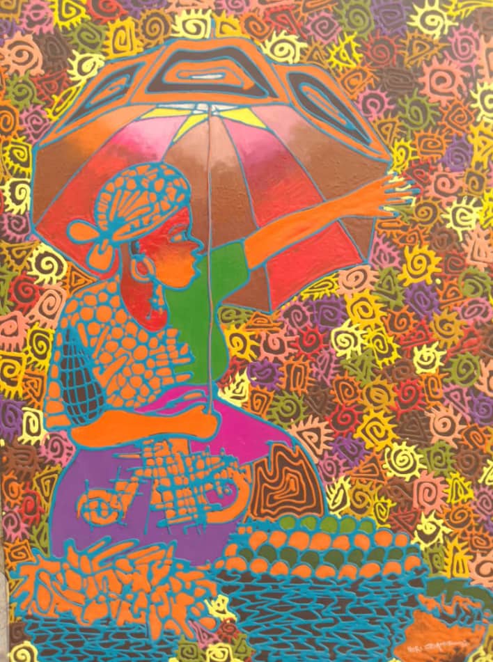 Woman with an umbrella in a patterned painting