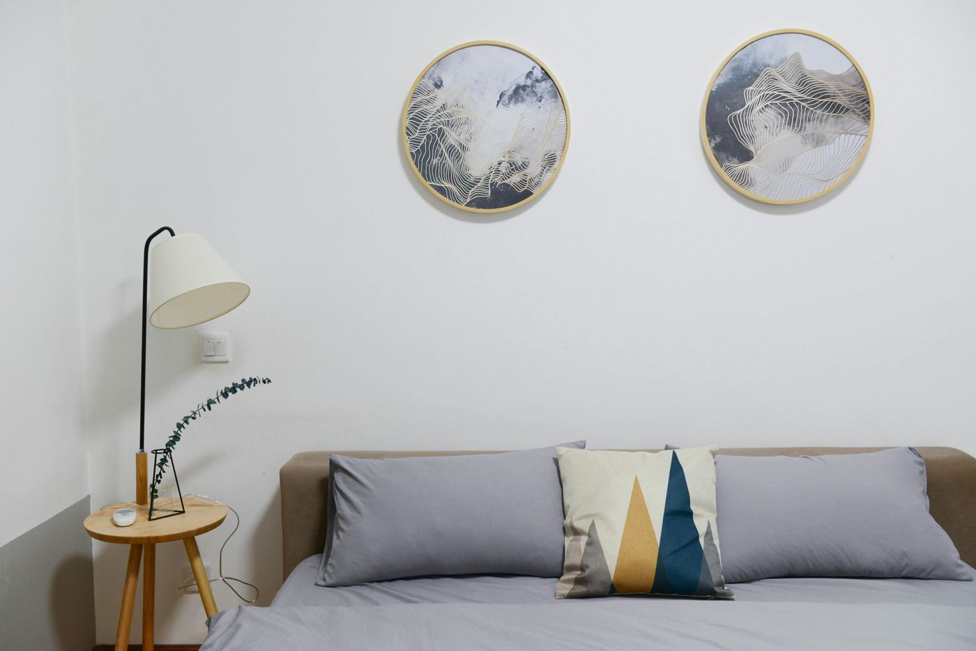 Bedroom with round wall art