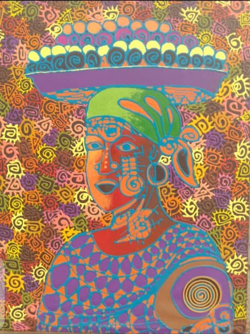 Woman in a patterned top with a basket on her head